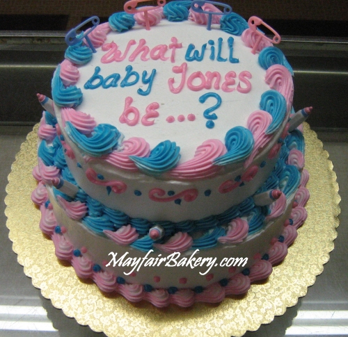 custom 2 tier gender reveal cake with pink and blue trim