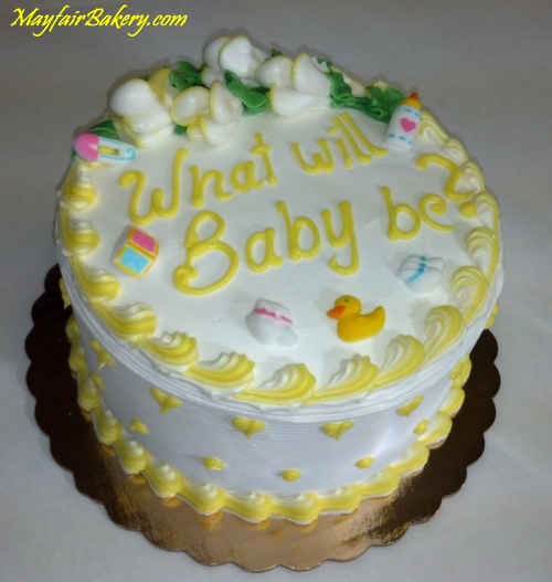 gender reveal cake with yellow trim